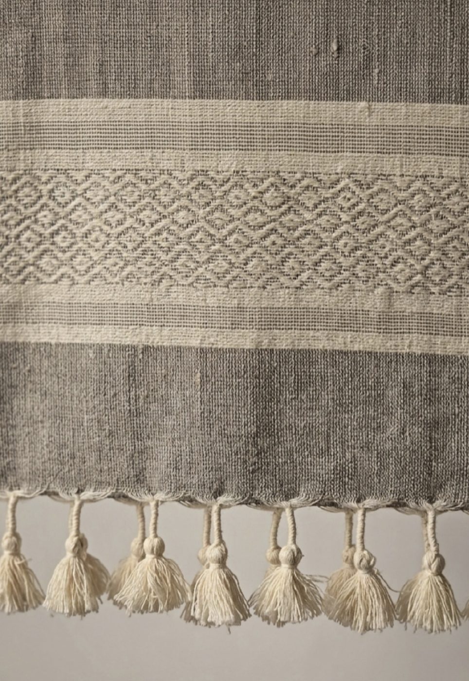 Close-up of the stone grey stole's woven border